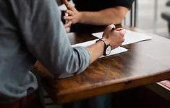 Man signing papers